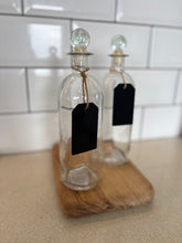 Glass bottles with chalkboard tag