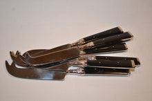 Black-handled cheese knife