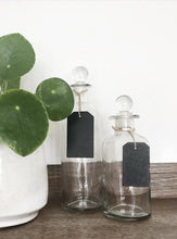 Glass bottles with chalkboard tag